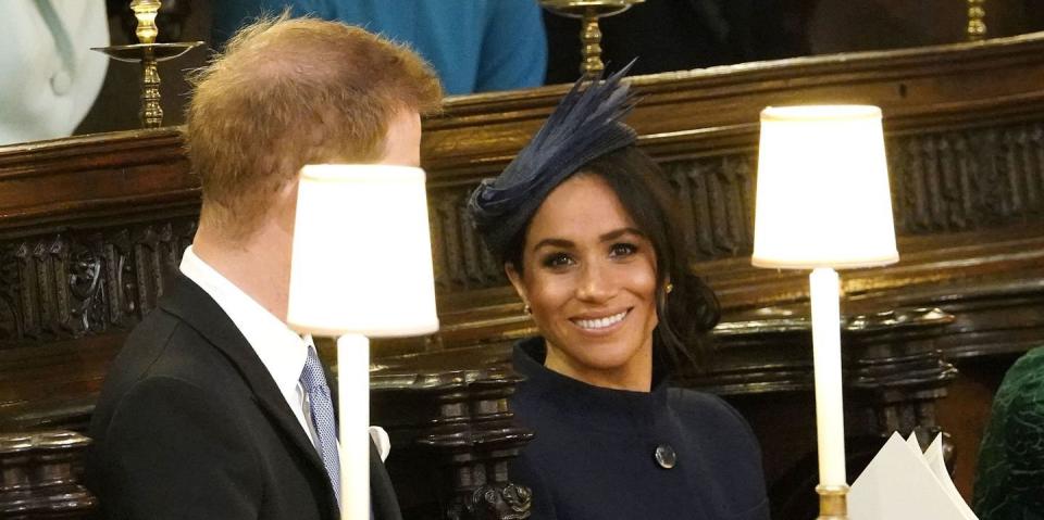 The Duchess of Sussex smiles in St. George's Chapel.&nbsp;