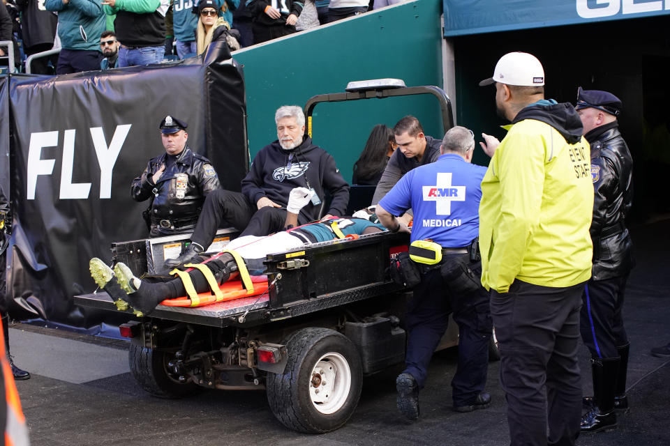 Philadelphia Eagles defensive end Josh Sweat is carted off the field after being injured in the first half of an NFL football game against the New Orleans Saints in Philadelphia, Sunday, Jan. 1, 2023. (AP Photo/Matt Rourke)