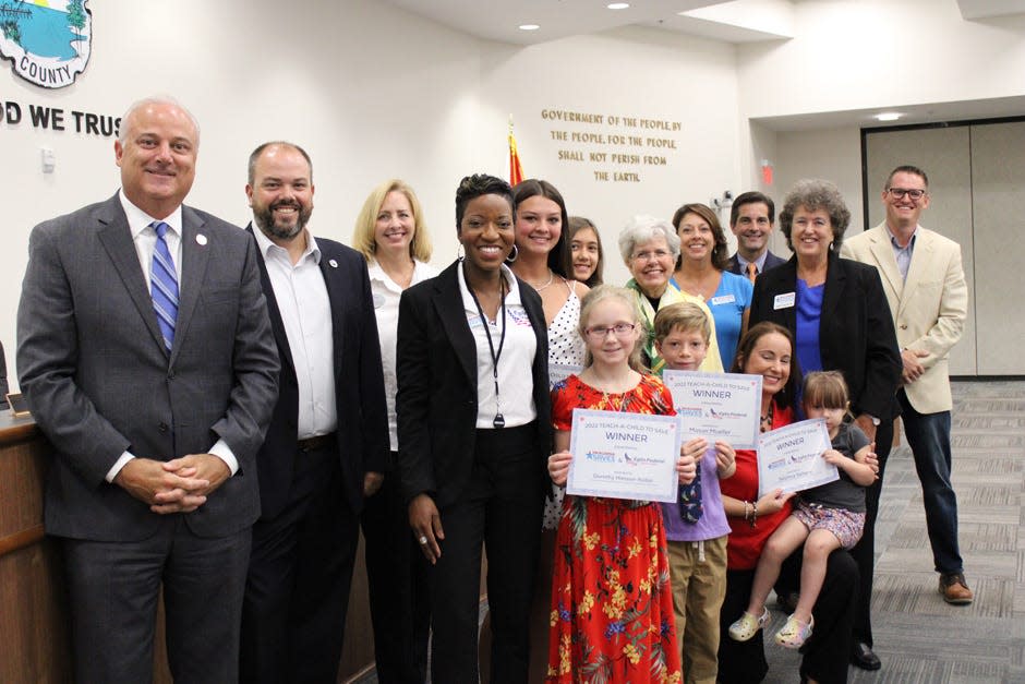 Winners of the Teach a Child to Save campaign were presented certificates by Okaloosa Saves at the Okaloosa Board of County Commissioners meeting July 19 in Shalimar.