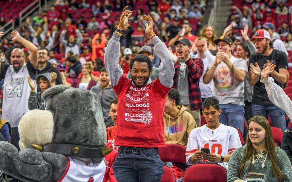 Fresno State fans cheer during the Bulldogs’ game against Utah State at the Save Mart Center in Fresno on Saturday, Jan. 28, 2023.