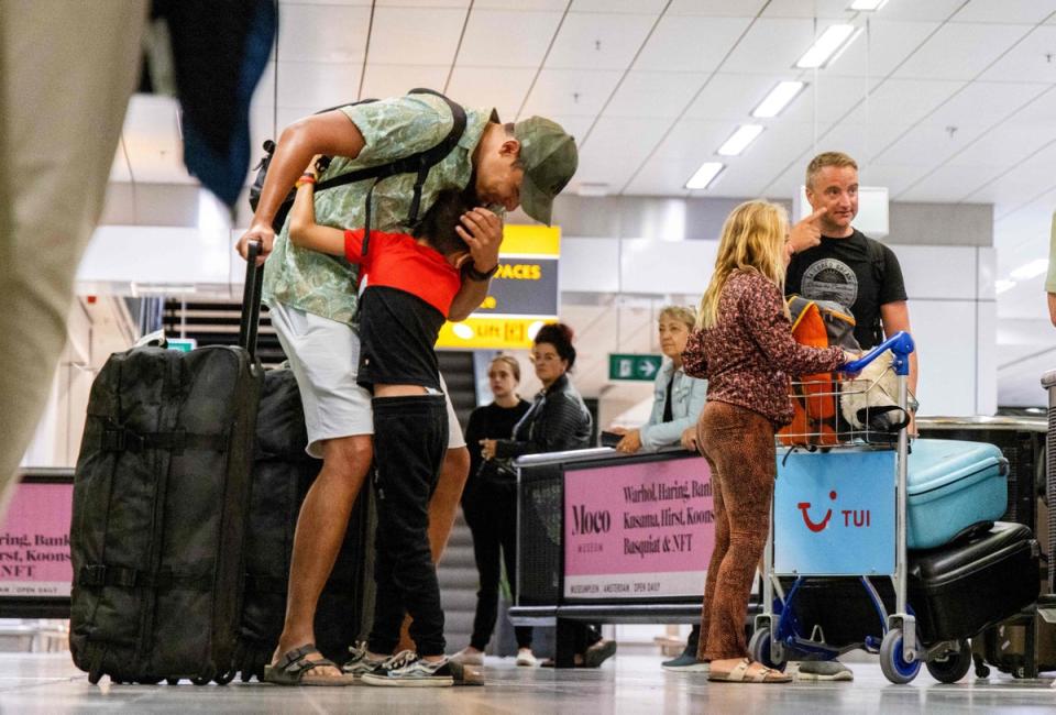 Holidaymakers arrive after returning from Rhodes where evacuations were taking place on 24 July (ANP/AFP via Getty Images)
