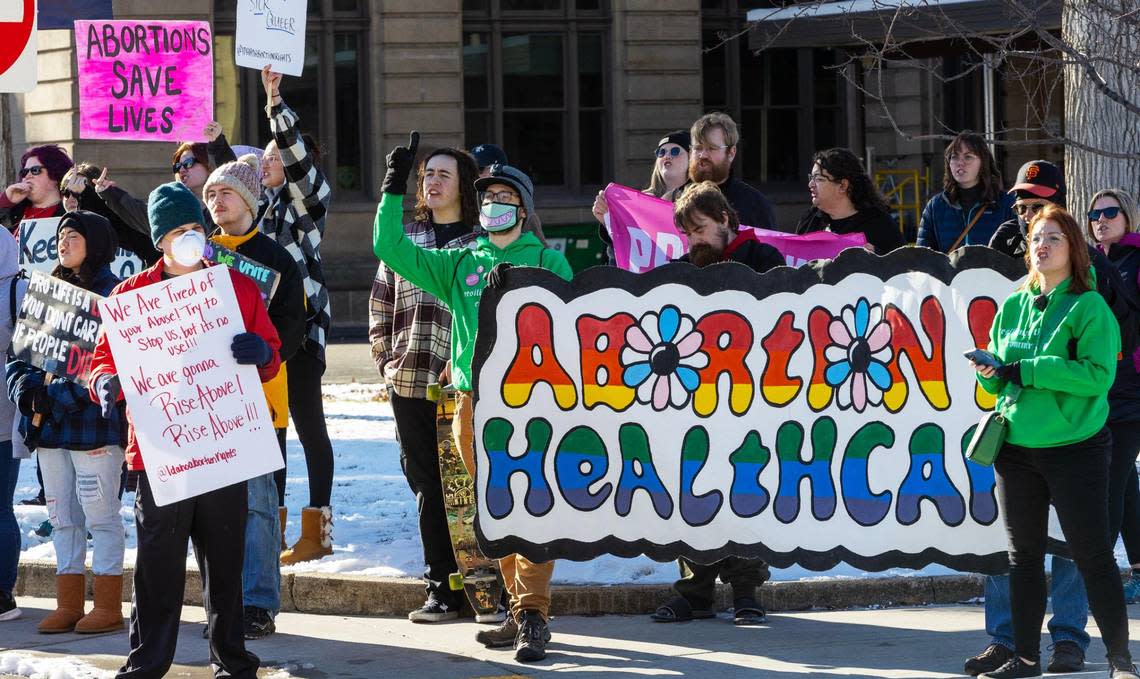 People against the abortion ban protest across the street from the March for Life rally at the Idaho Capitol on Saturday.