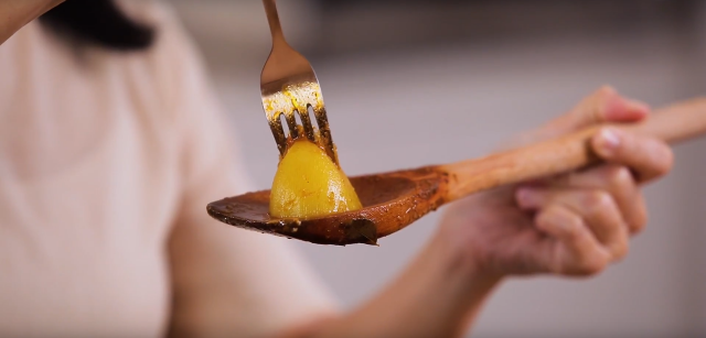 Poke a fork through the potato to check if it is cooked