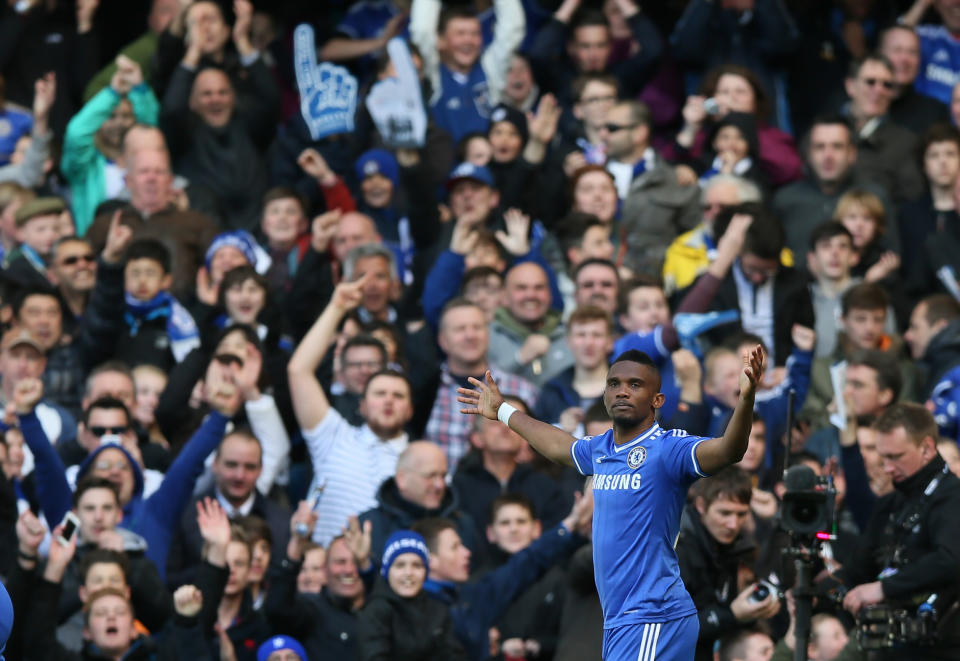 Chelsea's Samuel Eto'o celebrates after scoring his sides opening goal during their English Premier League soccer match between Chelsea and Arsenal at Stamford Bridge stadium in London, Saturday, March 22, 2014. (AP Photo/Alastair Grant)