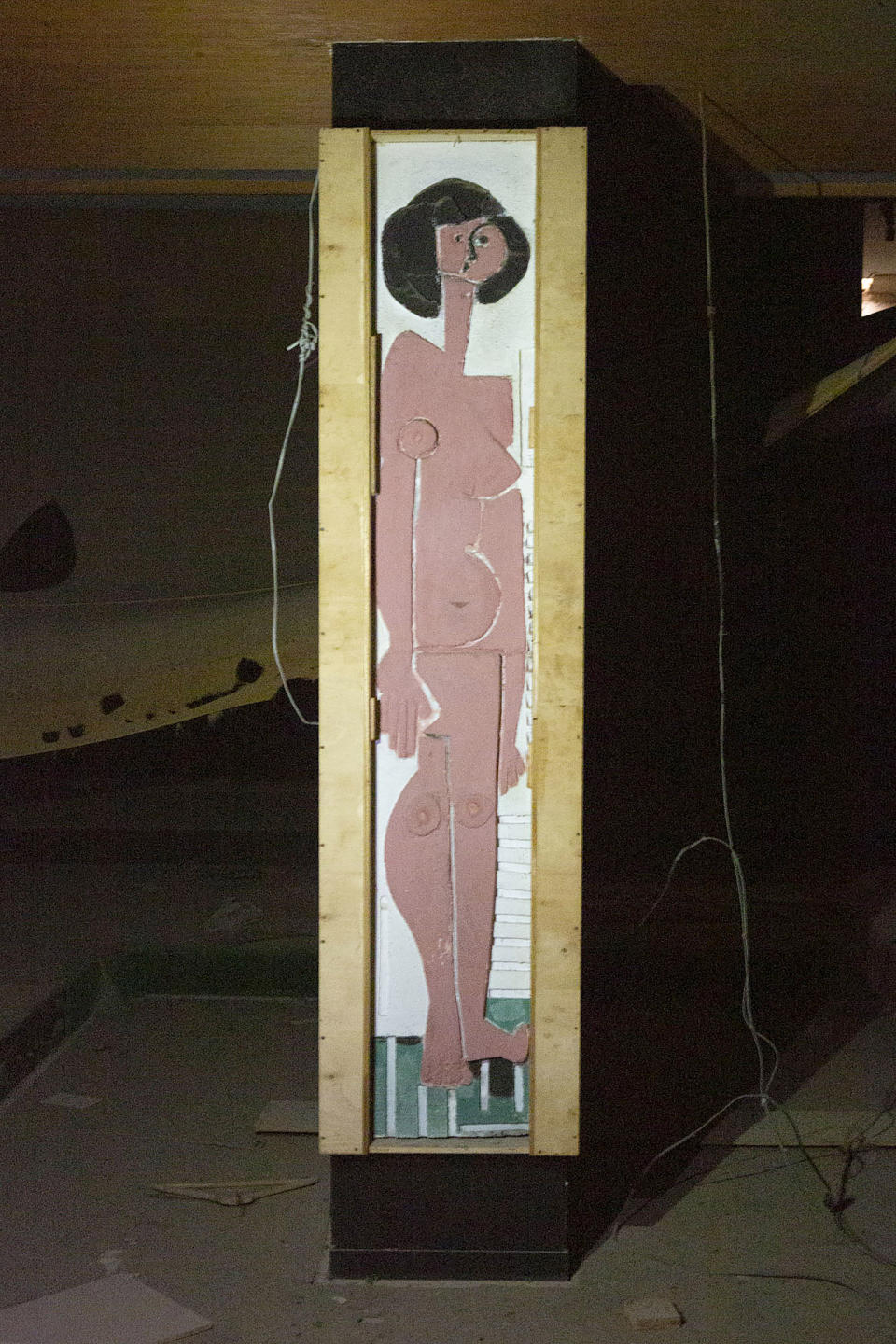 In this Tuesday Oct. 20, 2020 shows a priceless and very rare concrete relief by Cyprus' most avant-garde artist of the 1960s, Christoforos Savva, appears on the wall of the defunct Perroquet nightclub in the abandoned ghost-town of Varosha in the breakaway, Turkish Cypriot north of ethnically divided Cyprus. The artwork has been rediscovered after laying hidden for nearly half a century and the 93 year-old Greek Cypriot man who says he commissioned the reliefs wants them transferred to the country's internationally recognized southern part with the help of a bicommunal committee tasked with preserving and maintaining Cyprus' culture heritage. (Eleni Papadopoullou/Politis via AP)