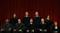 US Supreme Court Justices (first row L-R) Clarence Thomas, Antonin Scalia, John Roberts, Anthony Kennedy, Ruth Bader Ginsburg, (back row L-R) Sonia Sotomayor, Stephen Breyer, Samuel Alito and Elena Kagan on October 8, 2010