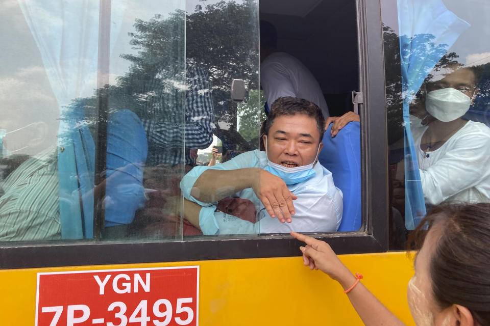 Released prisoners reacts from a bus while they leave from Insein Prison in Yangon, Myanmar Wednesday, May 3, 2023. Myanmar’s ruling military council on Wednesday said it was releasing more than 2,100 political prisoners as a humanitarian gesture. Thousands more remain imprisoned on charges generally involving nonviolent protests or criticism of military rule, which began when the army seized power in February 2021 from the elected government of Aung San Suu Kyi.(AP Photo/Thein Zaw)