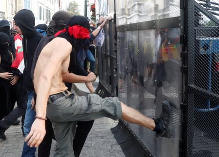 Demonstrators attack the police blockade during a protest against G7 summit, in Bayonne