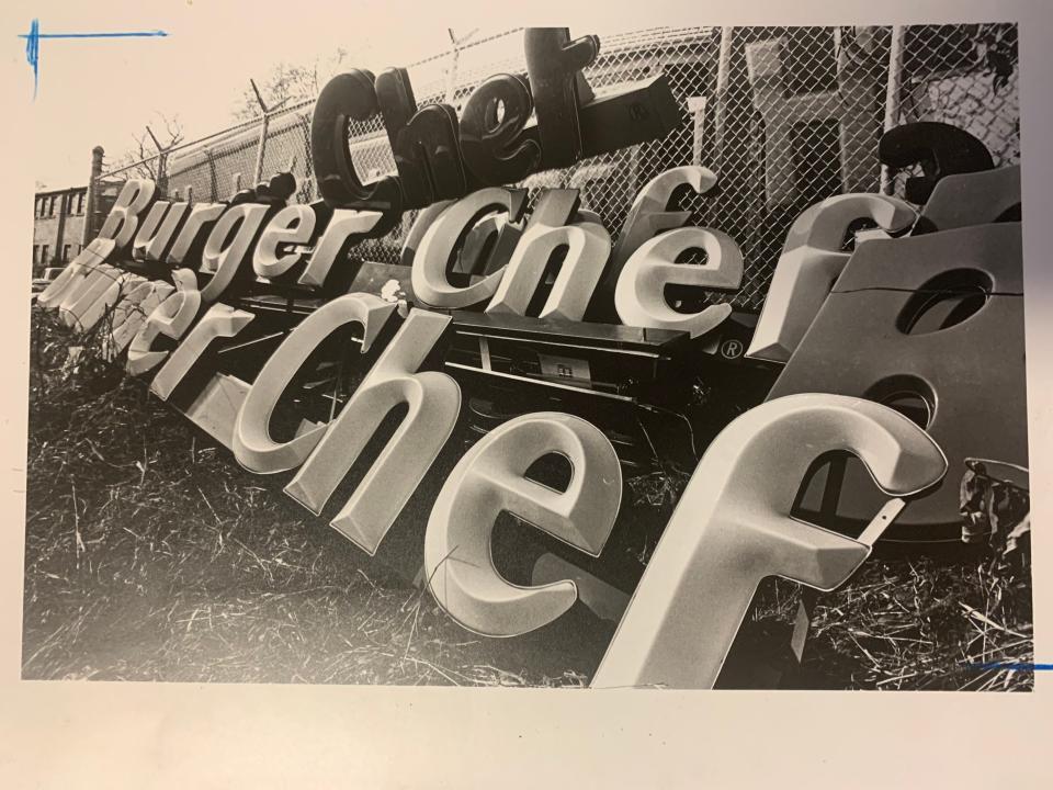 Old burger chef signs piled along Eastern Avenue in 1982