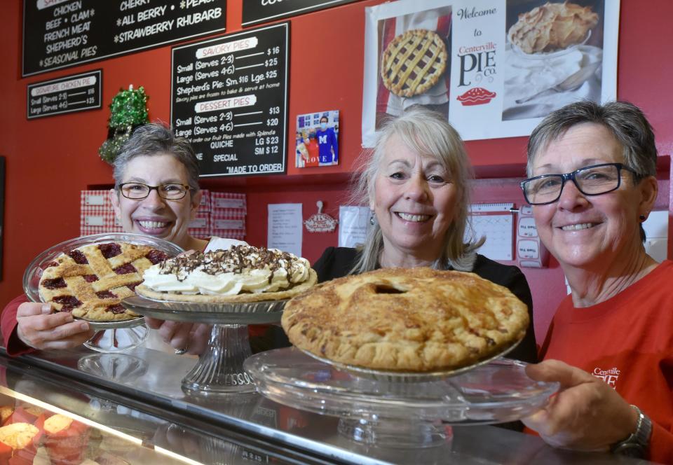 Centerville Pie employees Lisa Billiter, left, Cindy Smith and Diane Thayer pose with customer favorites, cherry, Cape Cod Crunch and apple pies at their Centerville bakery and shop on March 10.