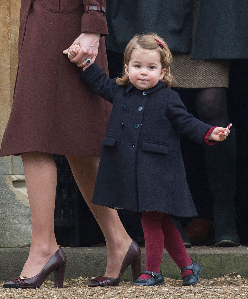 <p>Princess Charlotte attended a church service on Christmas Day in 2016 and dressed for the occasion in a double-breasted pea coat and burgundy tights. (Photo: Getty Images) </p>