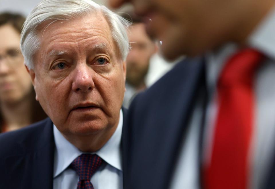 South Carolina Senator Lindsey Graham talks to members of the media as he makes his way to the Senate chamber at the US Capitol on 23 April 2024 in Washington DC (Getty Images)