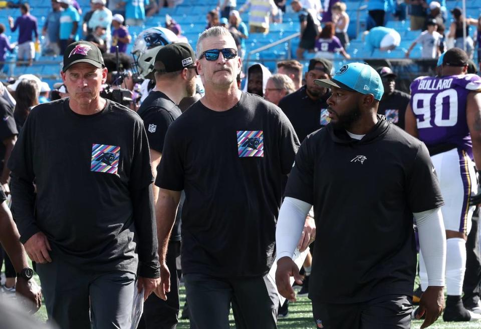Carolina Panthers head coach Frank Reich, center, walks off the field at Bank of America Stadium following the team’s 21-13 loss to the Minnesota Vikings on Sunday, October 1, 2023.