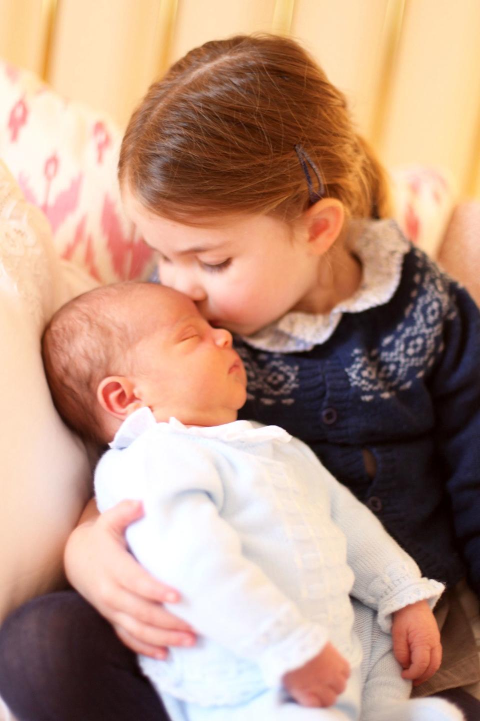 Princess Charlotte was ready for big sister duty when <a rel="nofollow noopener" href="https://people.com/tag/prince-louis/" target="_blank" data-ylk="slk:Prince Louis;elm:context_link;itc:0;sec:content-canvas" class="link ">Prince Louis</a> arrived, placing a sweet kiss on his forehead in the <a rel="nofollow noopener" href="https://people.com/royals/prince-louis-first-portrait-princess-charlotte/" target="_blank" data-ylk="slk:first official portraits of the baby;elm:context_link;itc:0;sec:content-canvas" class="link ">first official portraits of the baby</a>.