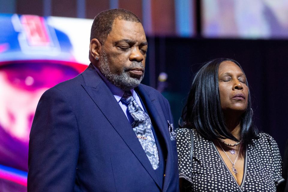 Rodney Wells and RowVaughn Wells, the parents of Tyre Nichols, close their eyes in prayer as a photo of their son looks on behind them during a press conference held by civil rights attorney Ben Crump after the Department of Justice announced that an indictment is pending in federal court for the five now-former Memphis police officers involved in the Tyre Nichols case at Mississippi Boulevard Baptist Church in Memphis, Tenn., on Tuesday, September 12, 2023.