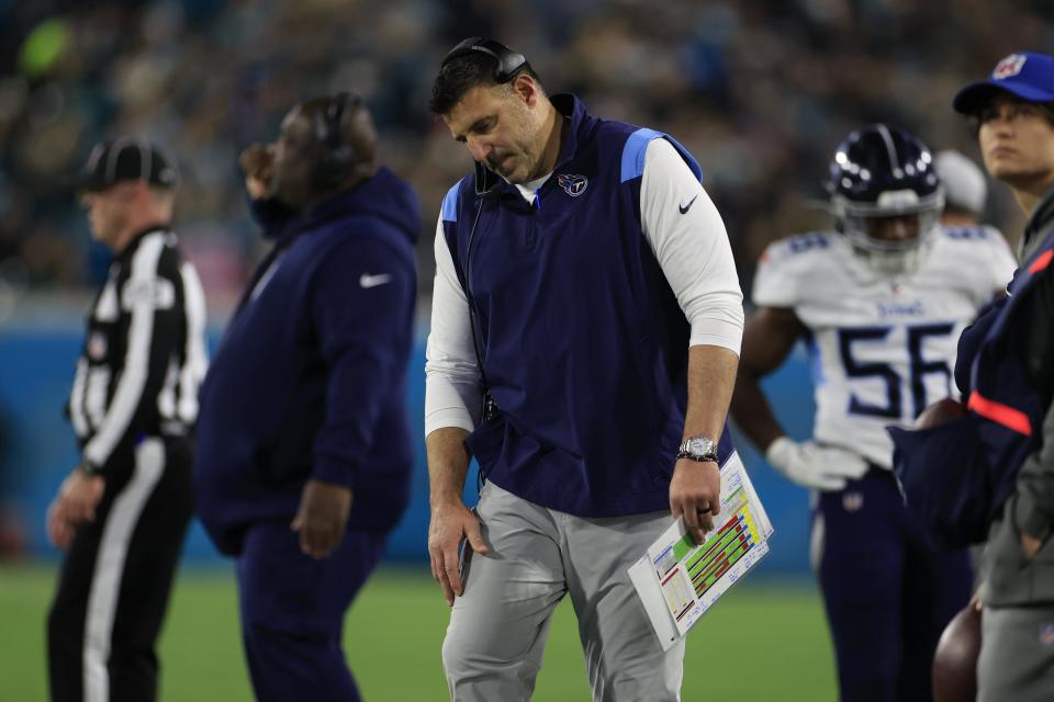 Tennessee Titans head coach Mike Vrabel listens on his headset during the second quarter of an NFL football regular season matchup AFC South division title game Saturday, Jan. 7, 2023 at TIAA Bank Field in Jacksonville. [Corey Perrine/Florida Times-Union]