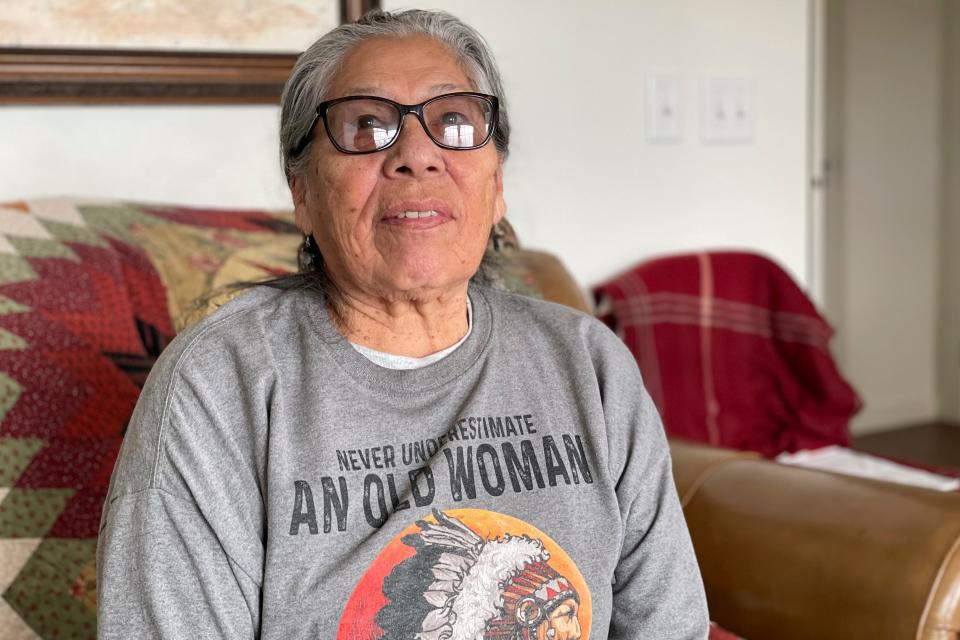 Madonna Thunder Hawk, 83, sits in her home near Rapid City, S.D., on Feb. 9, 2023. She was one of the four women medics during the occupation of Wounded Knee, which started on Feb. 27, 1973 and ended May 8, 1973. “I would crawl out there every night, and we’d just be out there in case anybody got hit,” she recalls. (Kalle Benallie/Indian Country Today via AP)