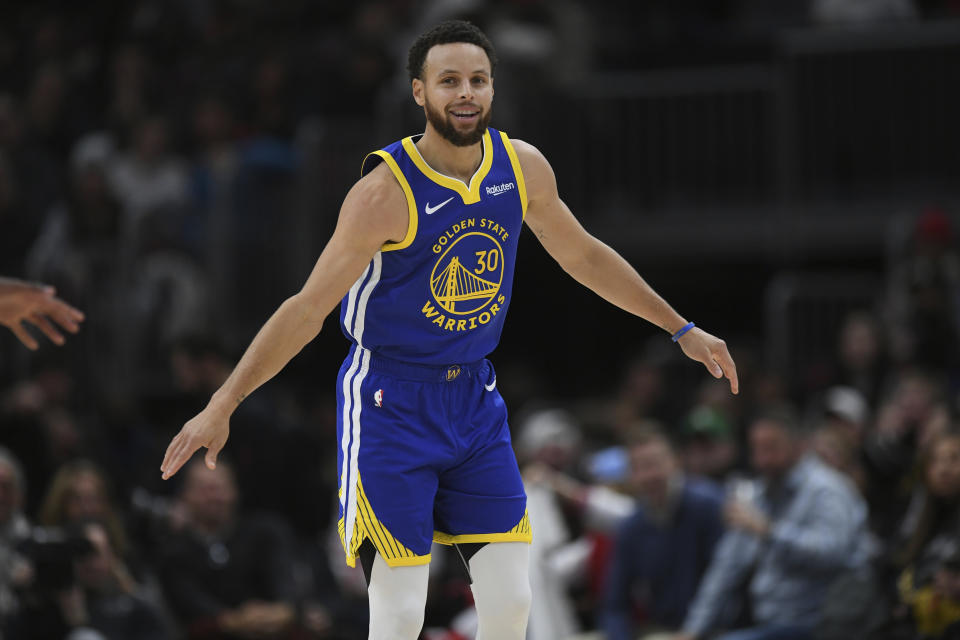 Golden State Warriors' Stephen Curry celebrates after making a 3-point basket during the final minutes of an NBA basketball game against the Chicago Bulls, Friday, Jan 12, 2024, in Chicago. (AP Photo/Paul Beaty)