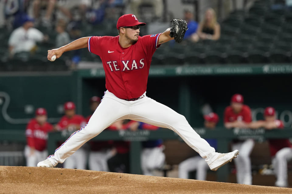 Texas Rangers starting pitcher Dane Dunning throws during the first inning of the team's baseball game against the Boston Red Sox in Arlington, Texas, Friday, May 13, 2022. (AP Photo/LM Otero)