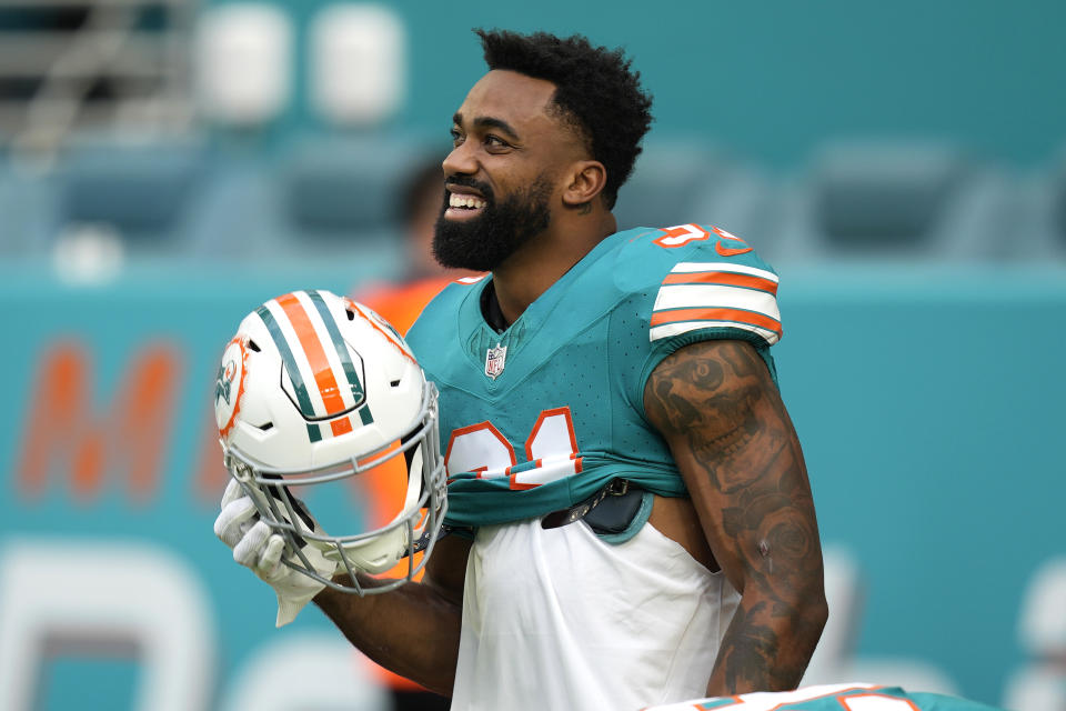 Miami Dolphins running back Raheem Mostert stands on the field before an NFL football game against the Dallas Cowboys, Sunday, Dec. 24, 2023, in Miami Gardens, Fla. (AP Photo/Rebecca Blackwell)