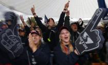 Supporters of Germany's Red Bull Formula One driver Sebastian Vettel celebrate during public viewing session of the Formula One Grand Prix of India in Dehli, in Vettel's hometown of Heppenheim, southwestern Germany, October 27, 2013. Vettel won the Grand Prix and his fourth successive driver's World Championship on Sunday. REUTERS/Kai Pfaffenbach (GERMANY - Tags: SPORT MOTORSPORT)