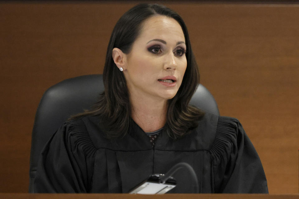 FILE - Florida Circuit Judge Elizabeth Scherer sentences Parkland shooter Nikolas Cruz at the Broward County Courthouse in Fort Lauderdale, Fla., Nov. 2, 2022. Cruz was formally sentenced to life in prison for murdering 17 people at Parkland's Marjory Stoneman Douglas High School on Feb. 14, 2018. A state commission concluded Monday, June 5, 2023, that Scherer, should be publicly reprimanded for showing bias toward the prosecution, failing to curtail “vitriolic statements” directed at his attorneys by the victims' families and sometimes “allowed her emotions to overcome her judgement.” (Amy Beth Bennett/South Florida Sun Sentinel via AP, Pool, File)