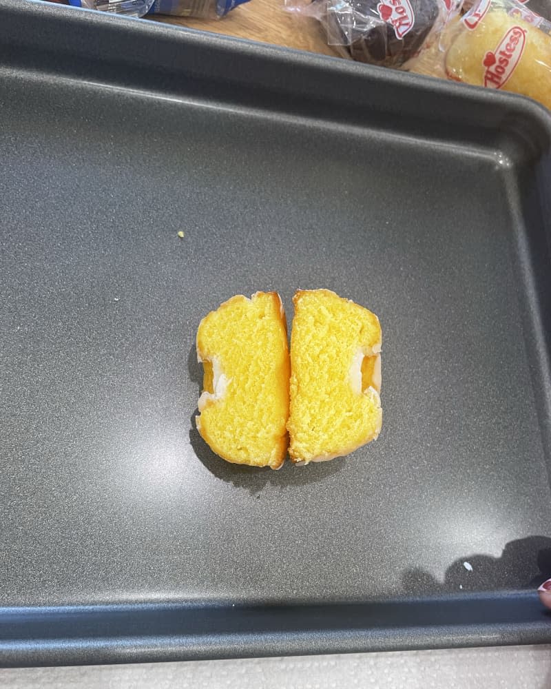 Lemon Bundt Hostess snack cut open on baking sheet