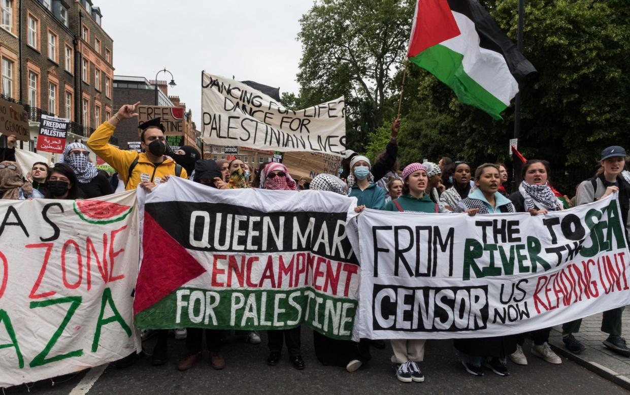 Protesters gather ahead of march through central London in solidarity with the Palestinian people