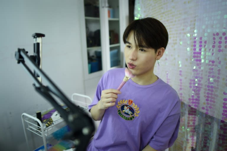 Jiang Cheng recording video at his home in Beijing as part of China's booming male cosmetics industry