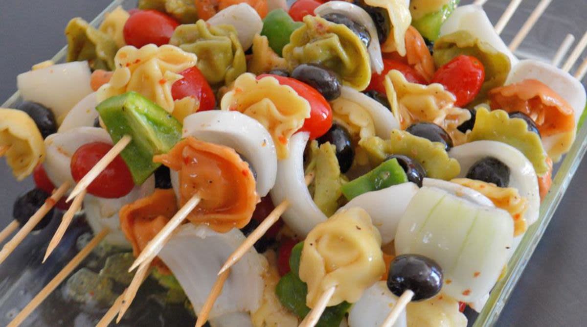 <p>Savory Experiments</p><p>Stuffed tortellini gives these summer skewers a surprising pop of flavor. </p><p><strong>Get the recipe: <a href="https://www.savoryexperiments.com/cold-tortellini-salad-skewers-2/" rel="nofollow noopener" target="_blank" data-ylk="slk:Cold Tortellini Salad Kabobs;elm:context_link;itc:0;sec:content-canvas" class="link rapid-noclick-resp">Cold Tortellini Salad Kabobs</a></strong></p>