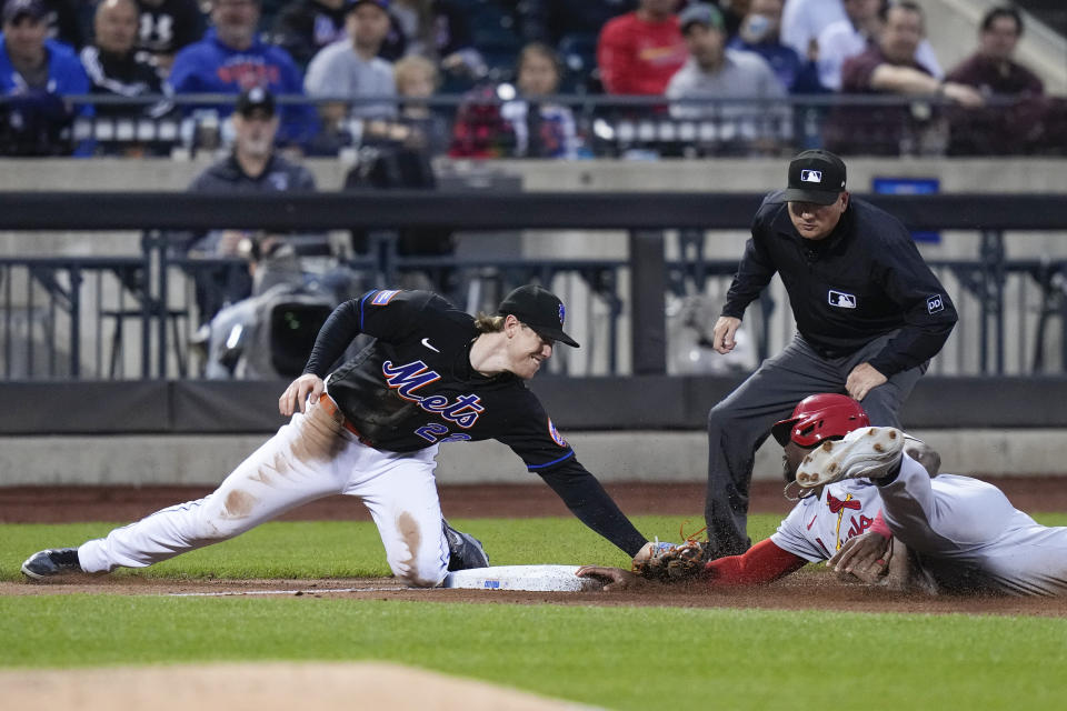 New York Mets third baseman Brett Baty tags out St. Louis Cardinals' Jordan Walker on a stolen-base attempt during the fifth inning of a baseball game Friday, June 16, 2023, in New York. (AP Photo/Frank Franklin II)