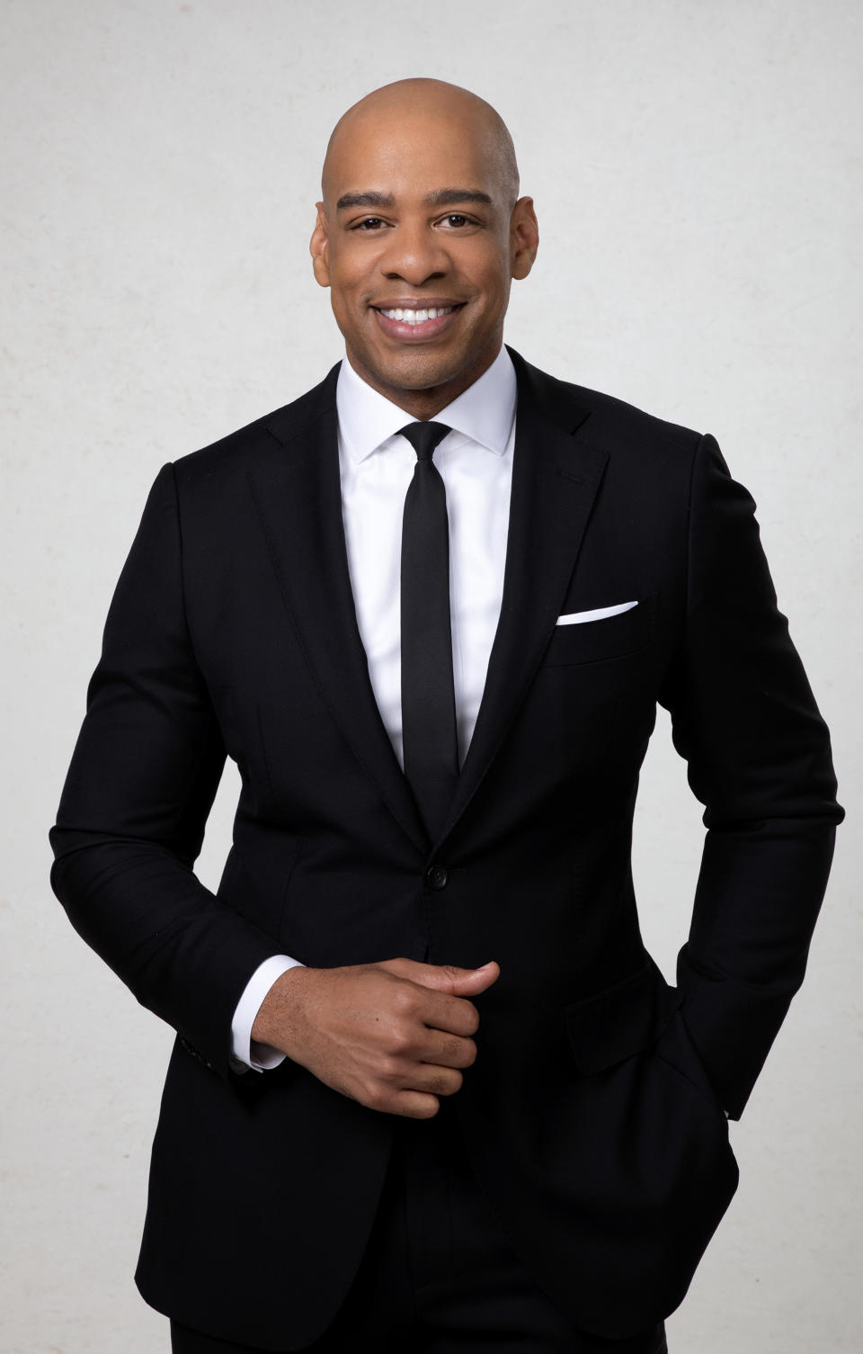 demarco morgan in a GMA3 promo photo wearing a suit and tie
