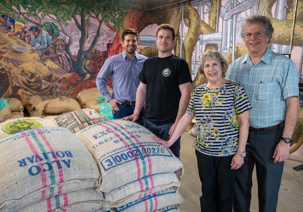 The Goldman family are photographed June 20 in the roasting room at their Good As Gold Coffee on Green Street. They are, from left, brothers Michael and Jay Goldman and their parents Pat and Dan Goldman.