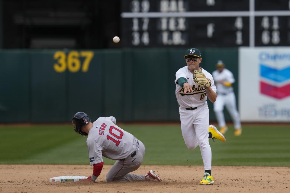 Oakland Athletics shortstop Nick Allen, right, turns a double play after forcing out Boston Red Sox's Trevor Story at second during the eighth inning of a baseball game Wednesday, April 3, 2024, in Oakland, Calif. (AP Photo/Godofredo A. Vásquez)