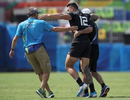 2016 Rio Olympics - Rugby - Preliminary - Men's Pool C New Zealand v Japan - Deodoro Stadium - Rio de Janeiro, Brazil - 09/08/2016. Joseph Webber (NZL) of New Zealand comes off the pitch after an injury. REUTERS/Phil Noble