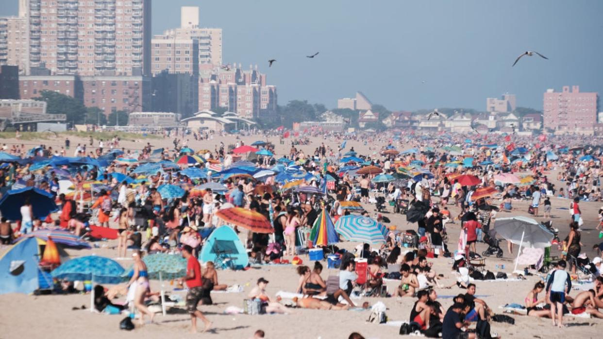 <div>People cool off at the beach in Coney Island on a hot afternoon. <strong>(Photo by Spencer Platt/Getty Images)</strong></div>