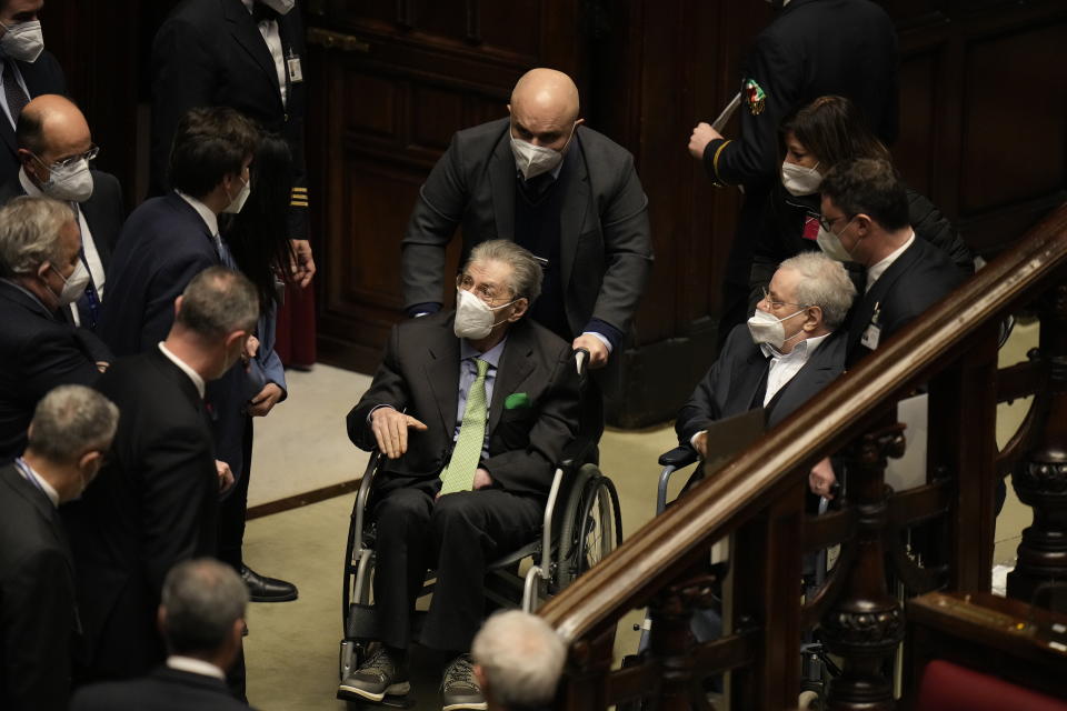 Italian senator and Northern League founder Umberto Bossi arrives in the Italian parliament, in Rome, Tuesday, Jan. 25, 2022 for the election of Italy's 13th president. A first round of voting in Italy's Parliament for the country's next president yielded an avalanche of blank ballots on Monday, as lawmakers and special regional electors failed to deliver a winner amid a political stalemate. (AP Photo/Alessandra Tarantino, pool)