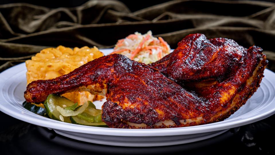 Cajun Spiced Half Chicken – brushed with BBQ sauce served with baked macaroni and cheese & coleslaw.