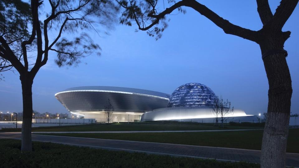 The Ennead Architects-designed Shanghai Astronomy museum emits an otherworldly glow at dusk.