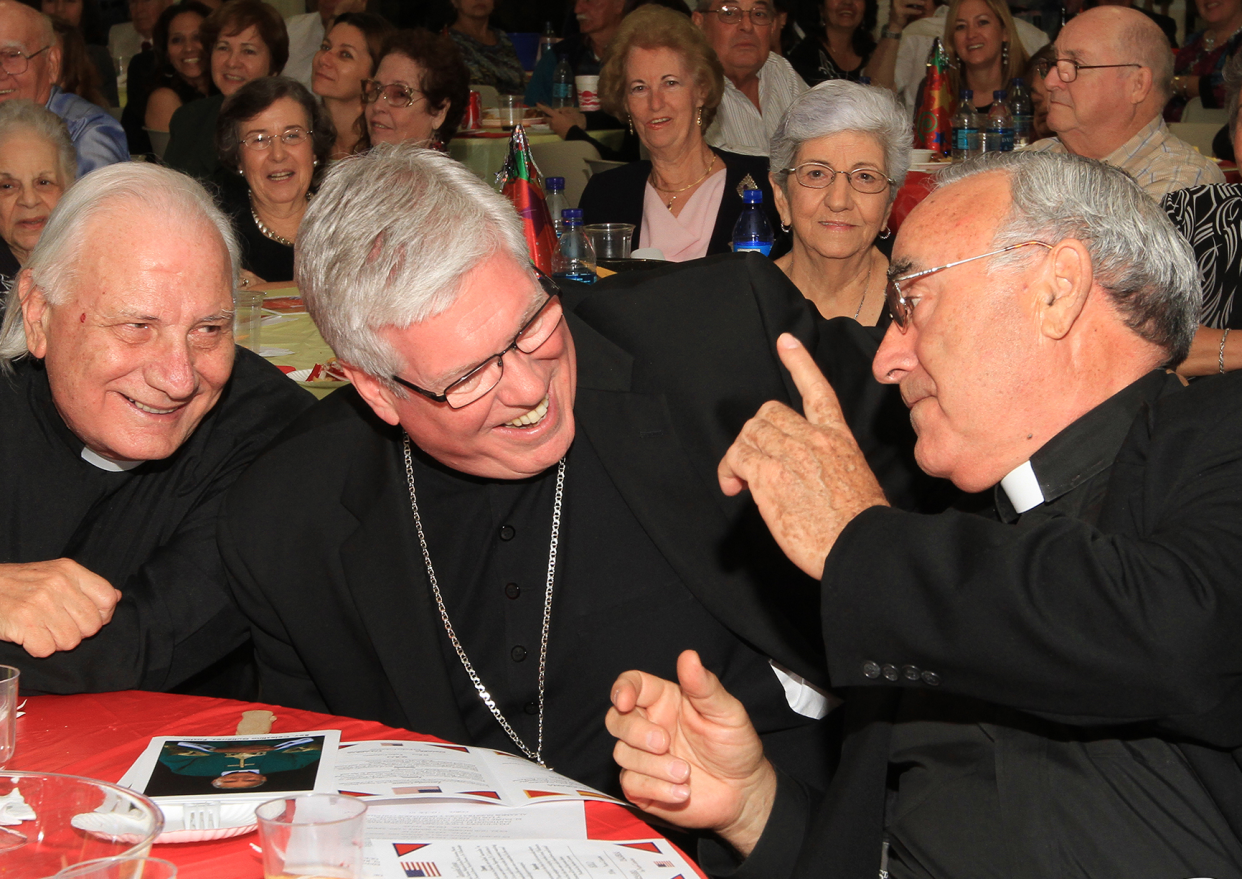 Father Celestino Gutiérrez shares a laugh with Most Rev. Frank J. Dewane, bishop of the Diocese of Venice in Florida, center, and Father Fausto Stampiglia during his 70th birthday celebration in 2010.