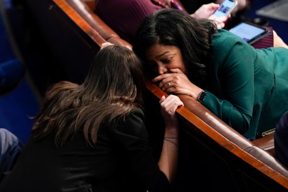 Rep. Alexandria Ocasio-Cortez, D-N.Y., left, talks with Rep. Pramila Jayapal, D-Wash., in the House chamber as the House meets for a second day to elect a speaker and convene the 118th Congress in Washington, Wednesday, Jan. 4, 2023.
