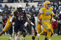 Southern University quarterback Glendon McDaniel (12) shouts as he scores on a four-yard touchdown run past Jackson State linebacker Aubrey Miller Jr. (45) during the first half of the Southwestern Athletic Conference championship NCAA college football game Saturday, Dec. 3, 2022, in Jackson, Miss. (AP Photo/Rogelio V. Solis)