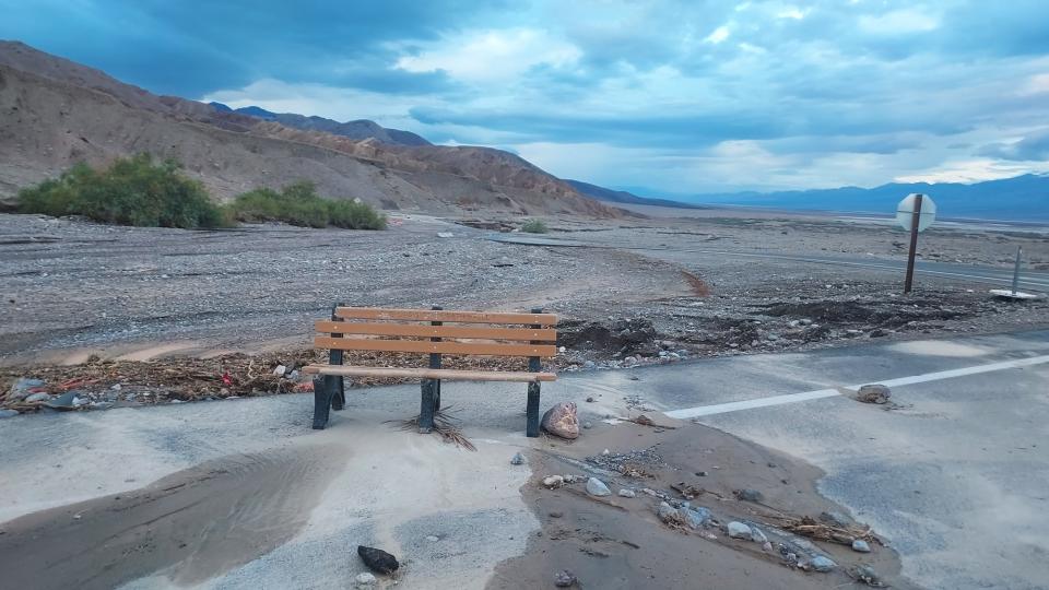 A bench is left on the road after floodwaters carried it away at Badwater. (NPS photo)
