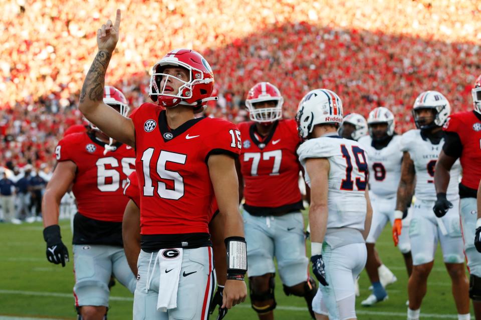 Georgia quarterback Carson Beck (15) celebrates after scoring a touchdown during the first half of a NCAA college football game against Tennessee Martin in Athens, Ga., on Saturday, Sept. 2, 2023.