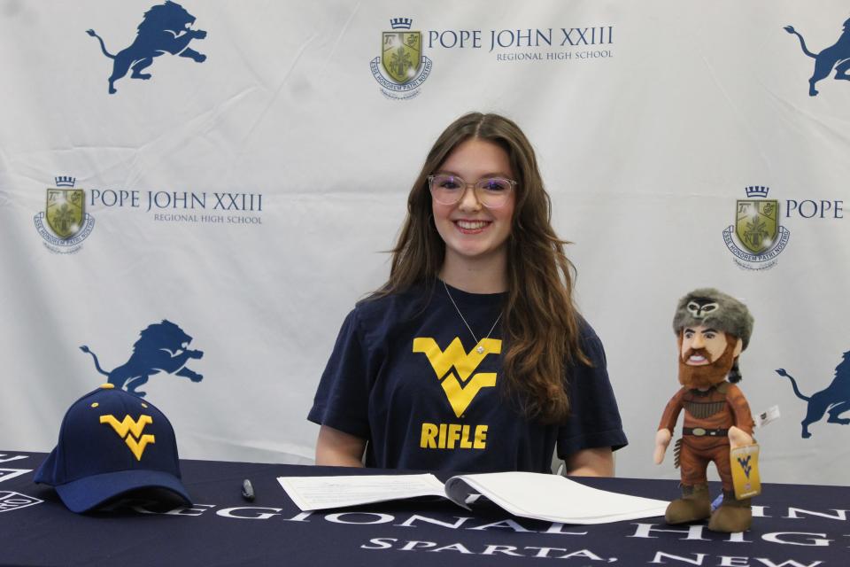 Pope John senior Ashlyn Blake signed a National Letter of Intent to continue her academic and riflery careers at West Virginia on Nov. 8, 2023.