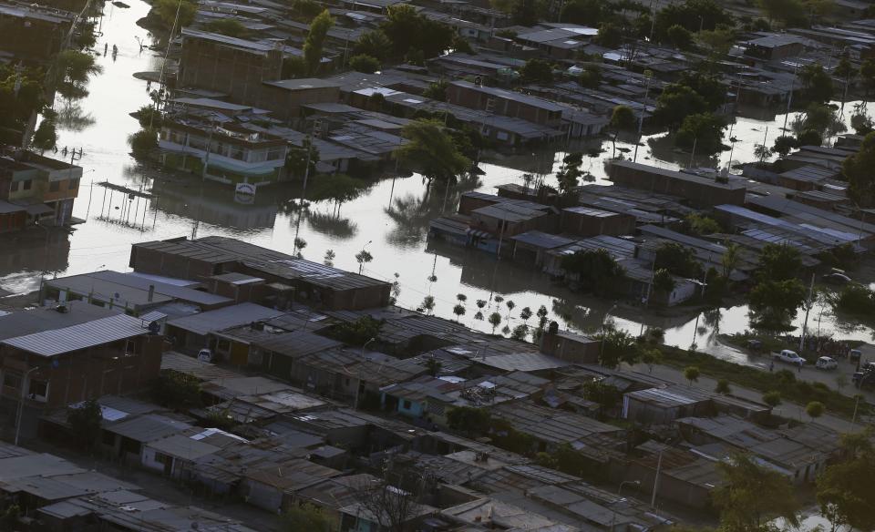 A flooded neighborhood is seen from the air in Piura, Peru, Wednesday, March 22, 2017. Intense rains, overflowing rivers, mudslides and flooding have hit the country, the worst seen in two decades, according to Peruvian authorities. (AP Photo/Martin Mejia)