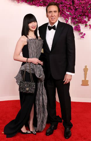 <p>John Shearer/WireImage</p> Riko Shibata and Nicolas Cage