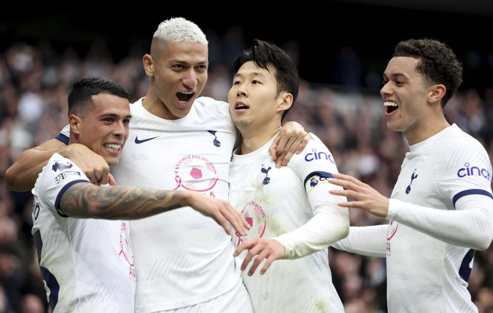 Tottenham Hotspur's Son Heung-Min, second from right, celebrates with his team mates after scoring his sides second goal during the English Premier League soccer match between Tottenham Hotspur and Luton Town at the Tottenham Hotspur Stadium, London, Saturday, March 30, 2024. (Steven Paston/PA via AP)