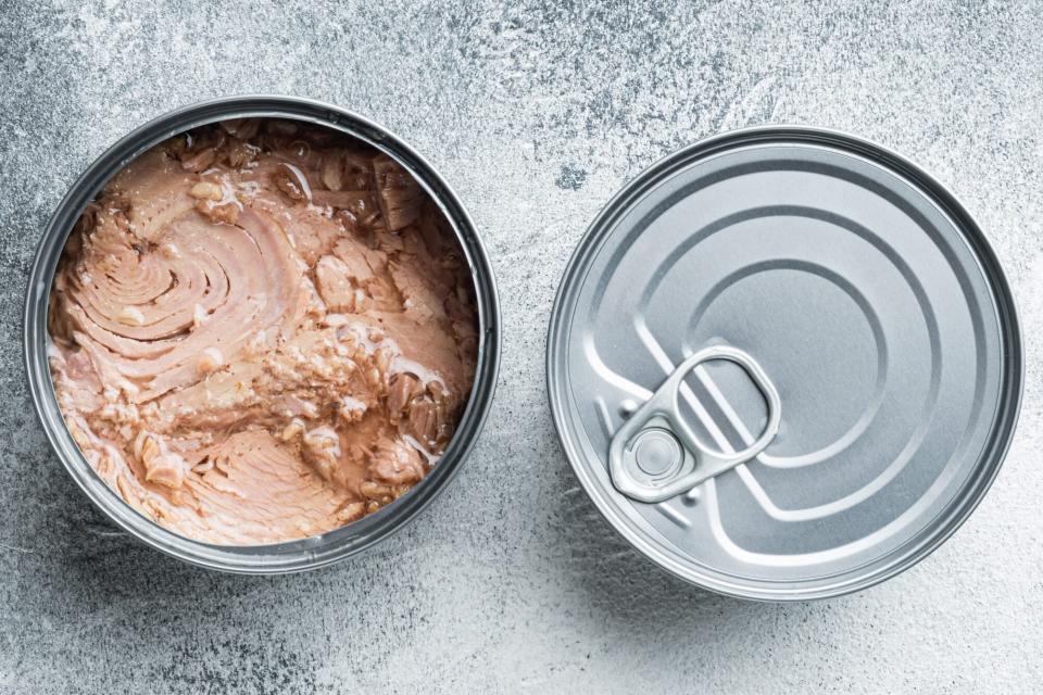 Canned Wild Yellowfin Tuna, in tin can, on gray background