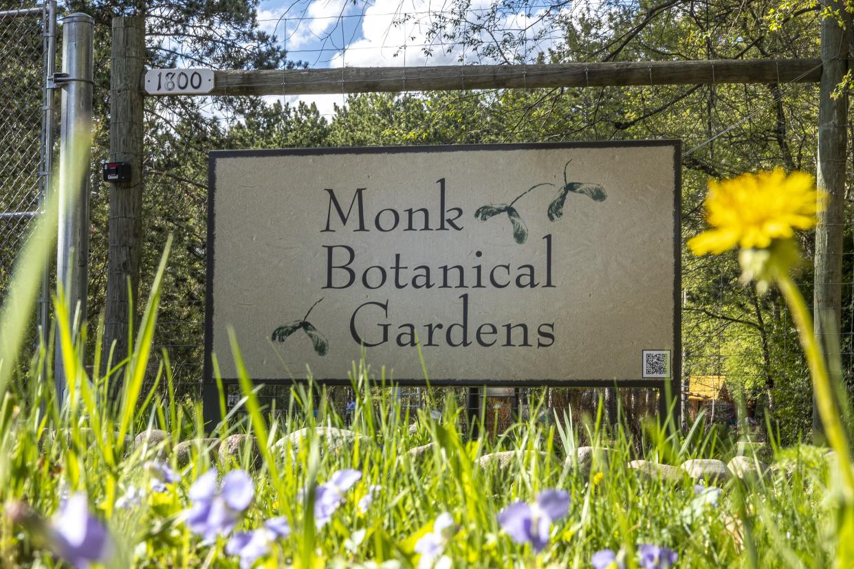 A sign that reads Monk Botanical Gardens is seen May 8 at the gardens in Wausau. On Wednesday, the board of directors for the botanical gardens announced it would reverse its decision to remove the Monk name from the gardens and return to the Monk Botanical Gardens name.